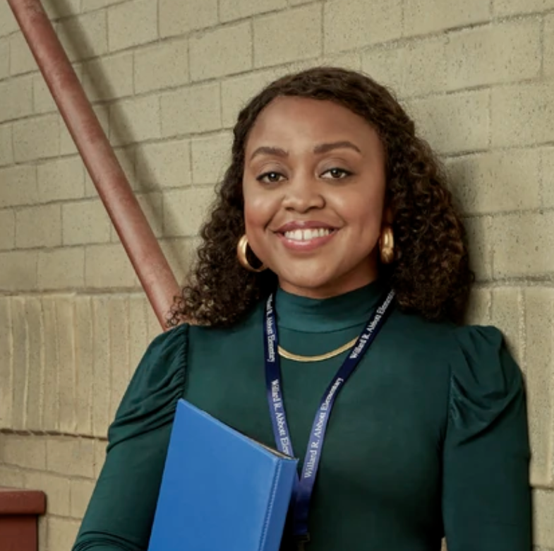 Ms. Teagues (Quinta Brunson) posing in the hall at Abbot Elementary