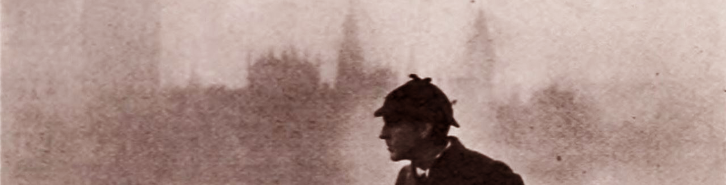 A movie still from a 1922 production of Sherlock Holmes with John Barrymore on a bridge before a foggy London skyline